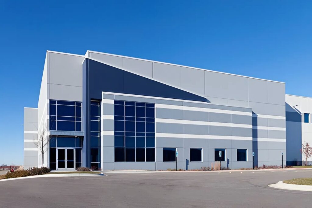 Modern commercial warehouse exterior with clean painted surfaces by a commercial painter in Orlando, FL